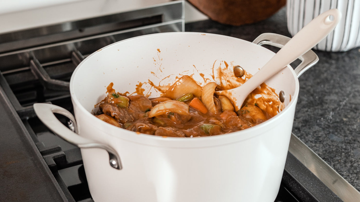 white ceramic stock pot with beef stew