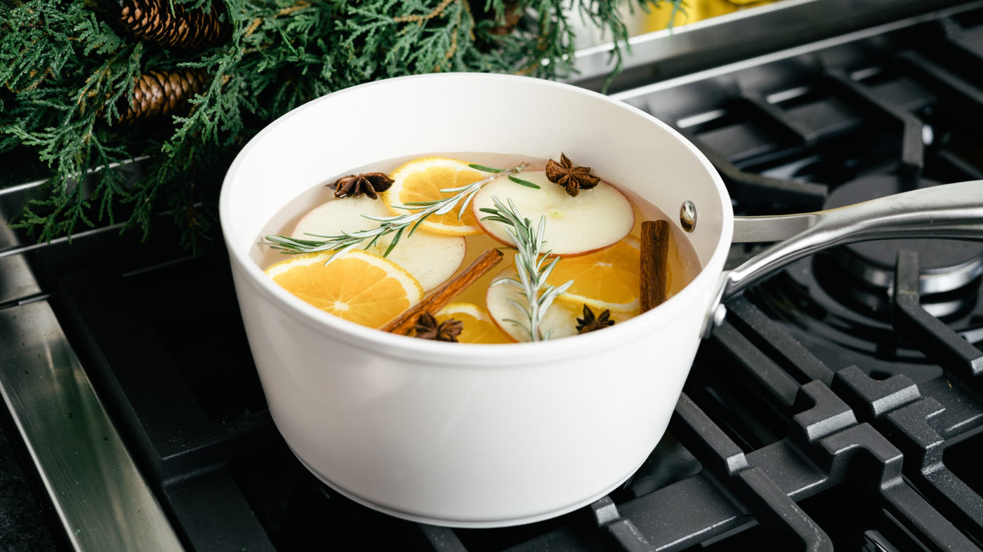 white ceramic saucepan with simmer pot ingredients