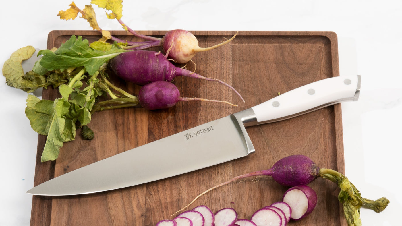white abs chef knife with radishes