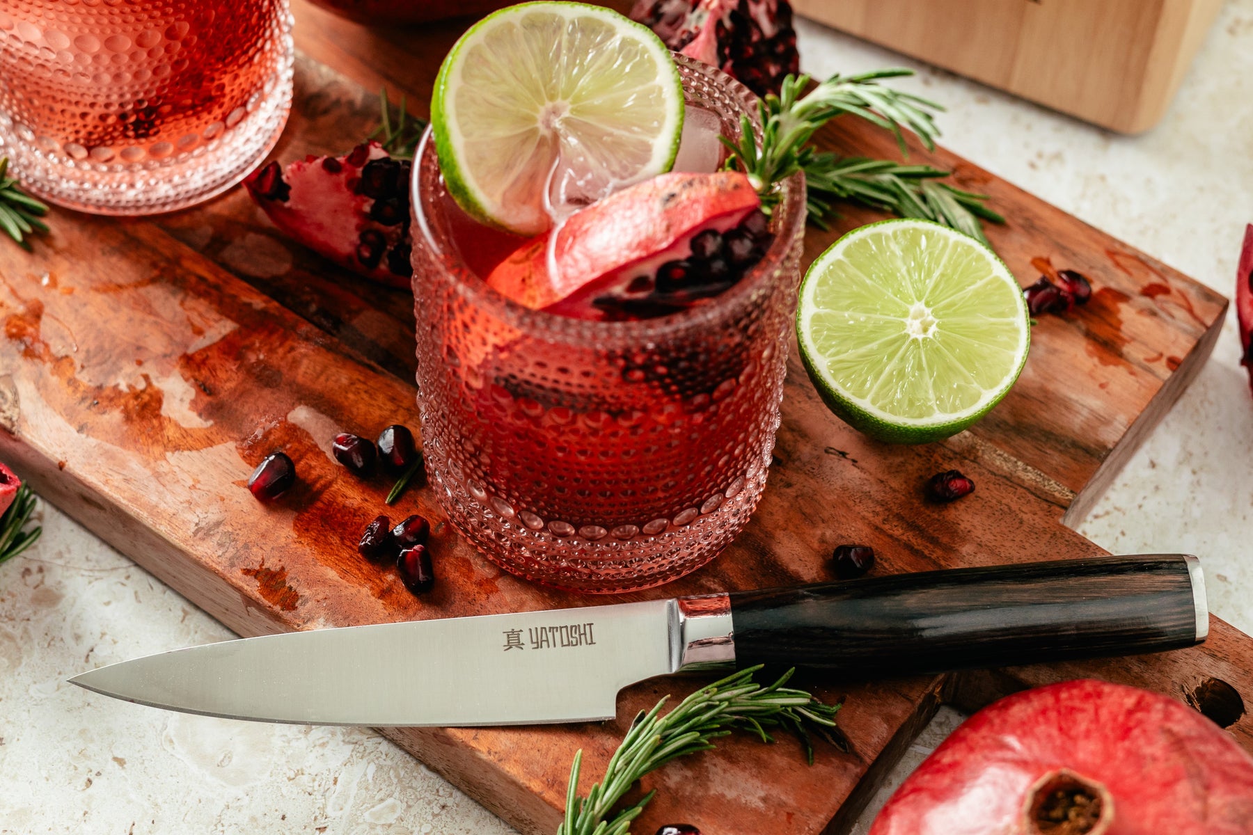 Dark brown utility knife next to a drink